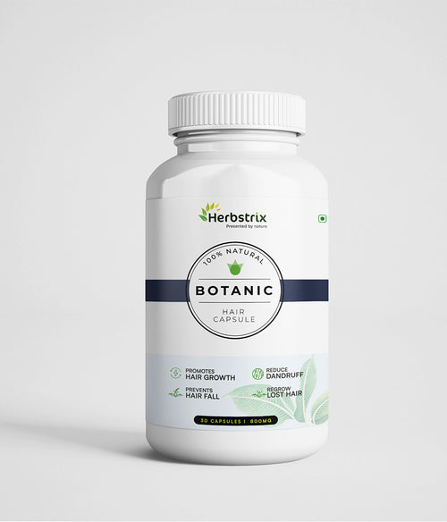 A bottle of Herbstrix Botanic Hair Capsule with a white label, indicating it is a natural hair supplement.